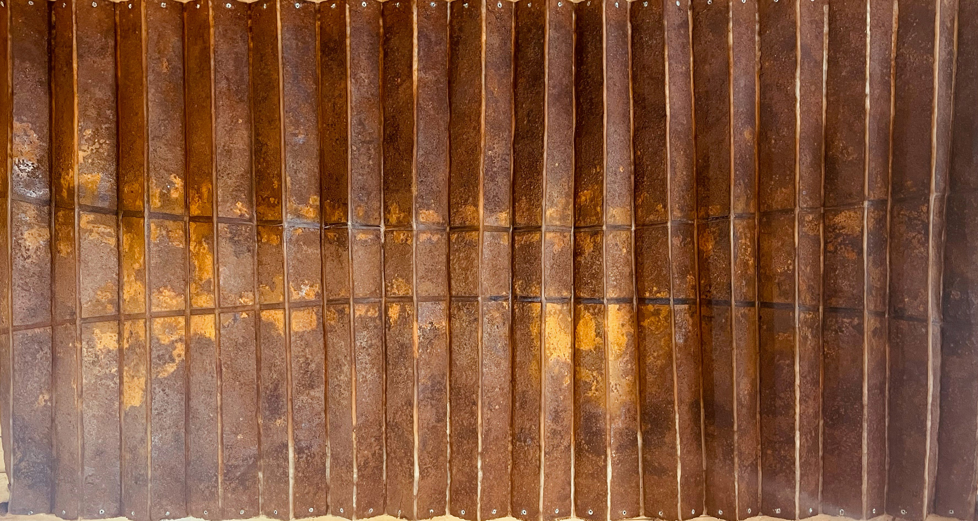 rust on pleated canvas artwork by Tony Reason